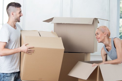 Careful wrapping of fragile household items during packing services